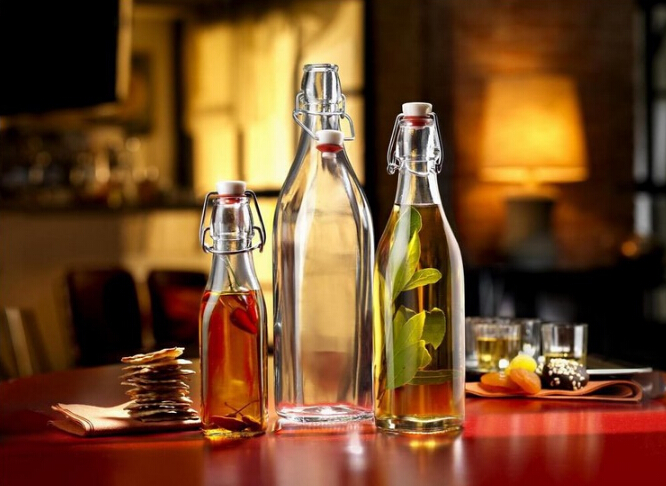 Wholesale Haonai Eco-Friendly food grade clear glass bottle with lock lid