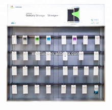 Display board mounted on wall for cell phone accessories at franchised store, exhibition and showroom