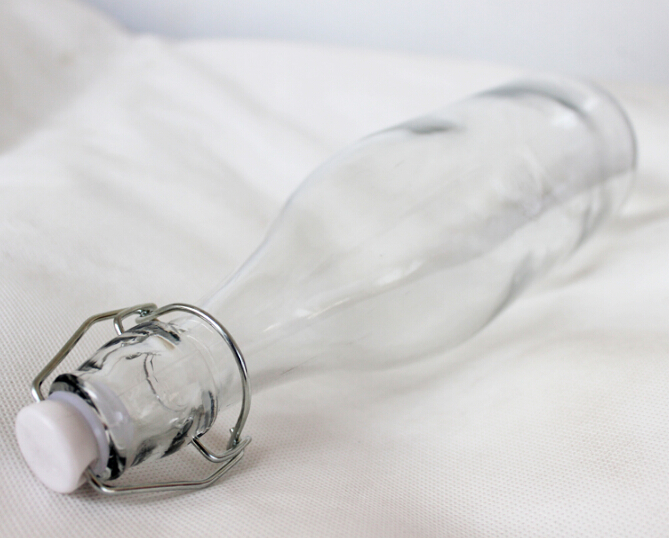 Wholesale Haonai Eco-Friendly food grade clear glass bottle with lock lid