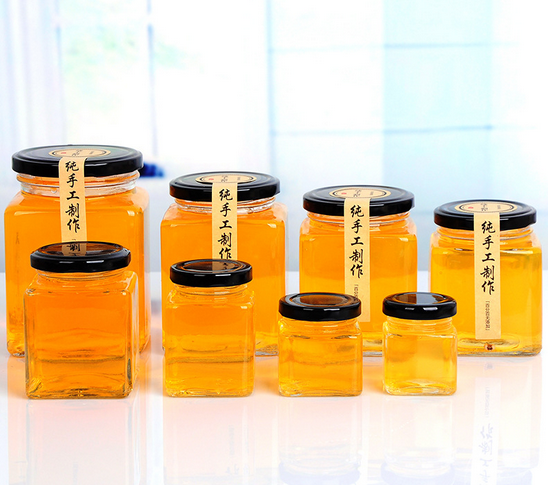 Haonai square glass honey jar/empty glass jar with black metal lid/clear glass jam jar.