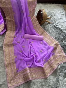 刺繍入りジョーゼットシルクサリーインドの伝統的なパーティーの結婚式は、生のシルクブラウスネパールの女性サリーと赤いサリーを着用します