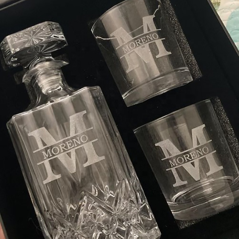 Whiskey glasses and whiskey bottles