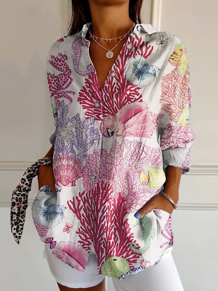 White shirt with coral, shell and fish patterns