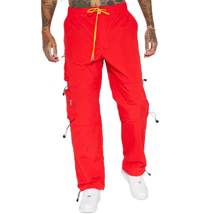 Pantalones cargo holgados de nailon de Color rojo para hombre superventas personalizados con cintura elástica y bolsillos, pantalones impermeables para hombre