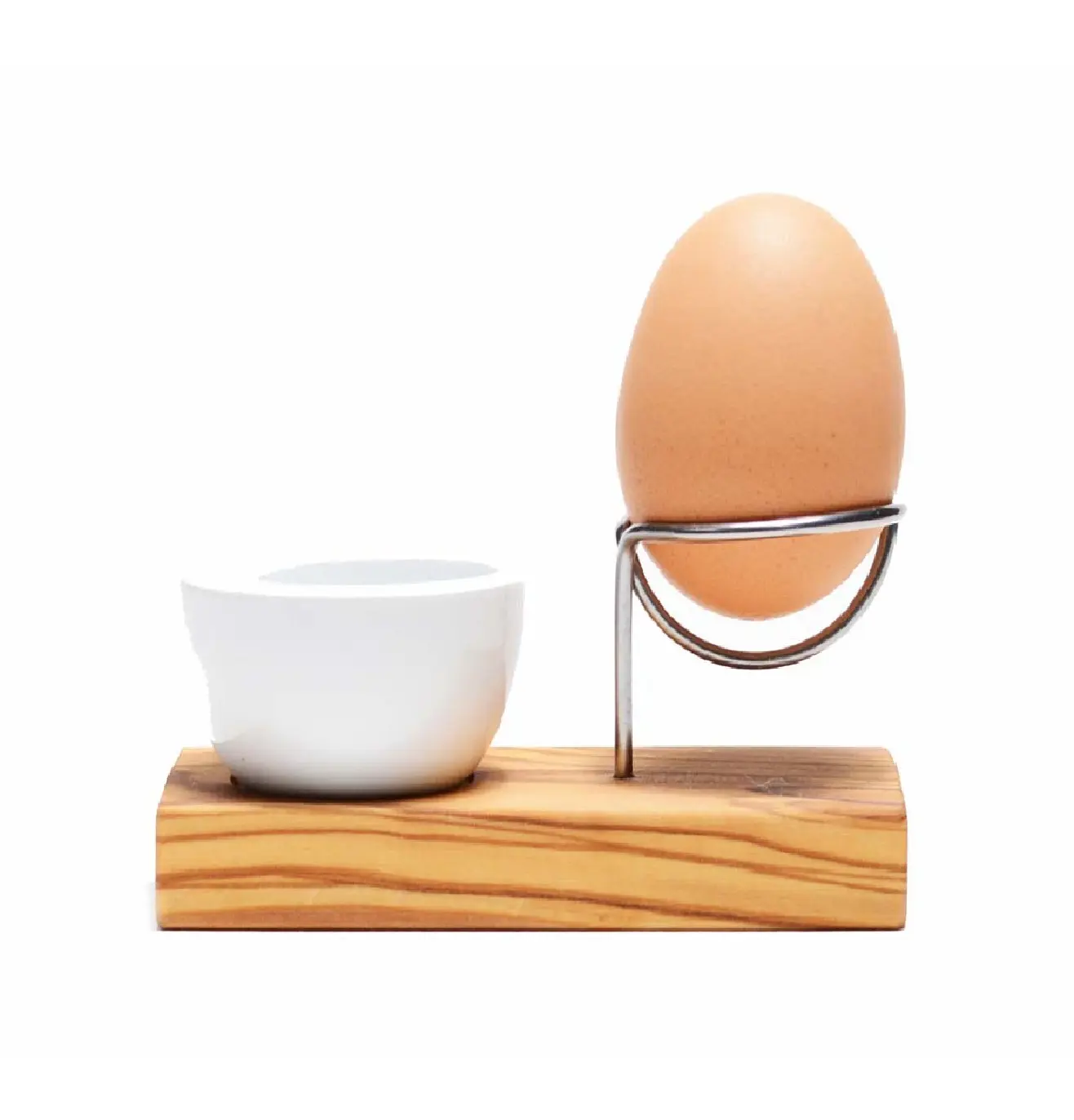 Innovativo porta uova in legno di ulivo e acciaio inossidabile accompagnato da un piccolo stampino in porcellana che terrà il guscio d'uovo rotto