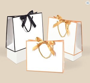 厂家直销各种专为购物设计、能装重物的卡纸制作礼品袋 - Product Image 5