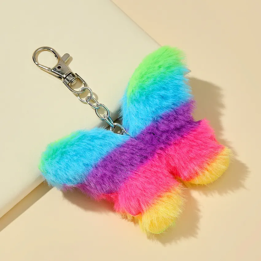 Chaveiro em forma de borboleta bonito pom pom de brinquedo de pelúcia chaveiro arco-íris bola de pele fofa pingente de borboleta charme