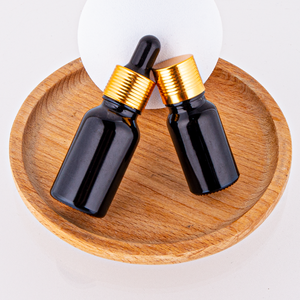 Venta al por mayor de fábrica 10ml 15ml 30ml 50ml 100mL botella de vidrio con gotas de aceite esencial negro brillante con tapa dorada botella vacía de suero - Product Image 5