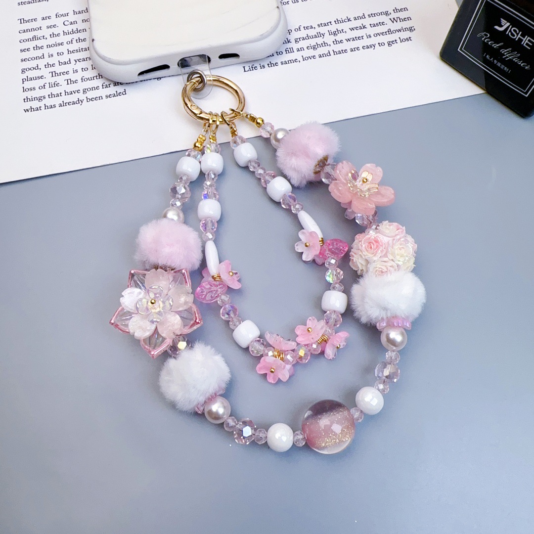 Chaîne courte pour téléphone avec boule de fleur lumineuse rose, style industriel lourd.