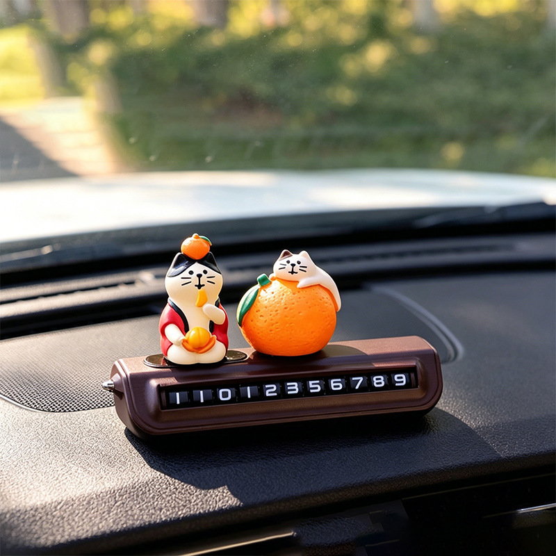 Orange cats and a pair of rolling number plates