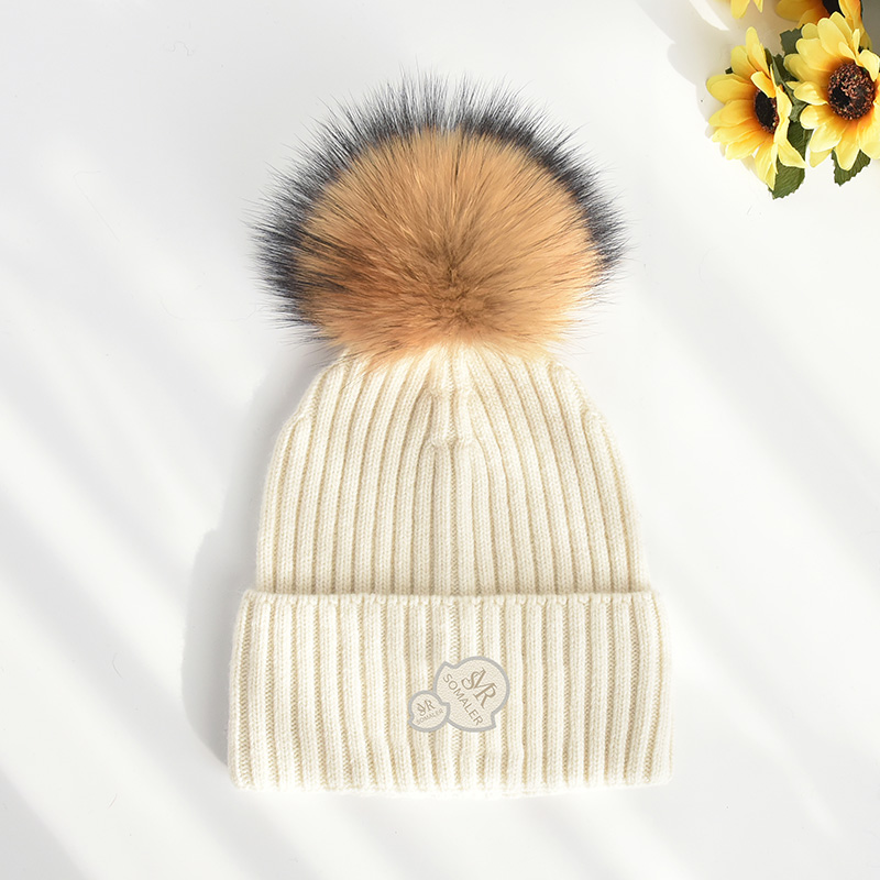 White with brown pom