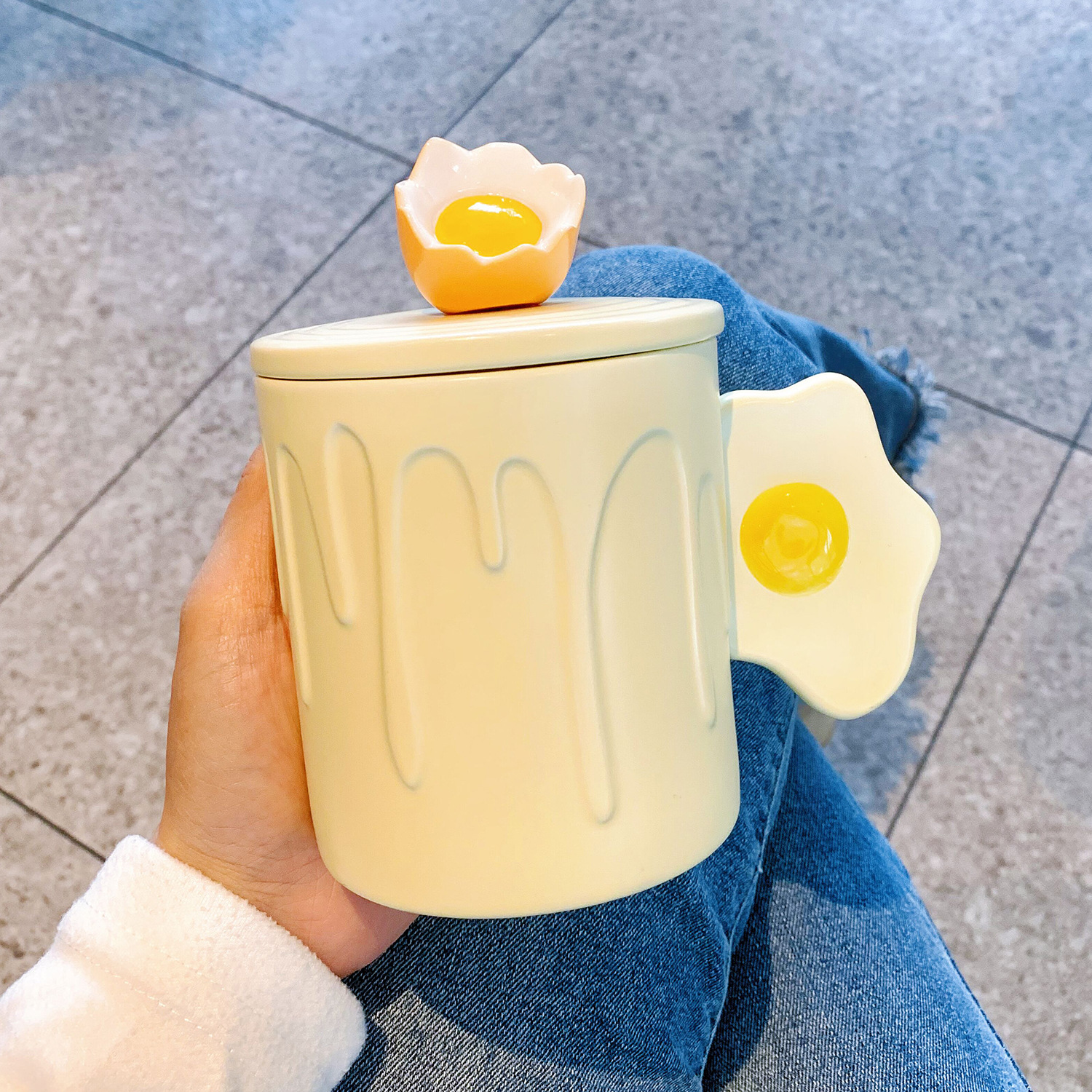 Yellow poached egg-cup lid spoon