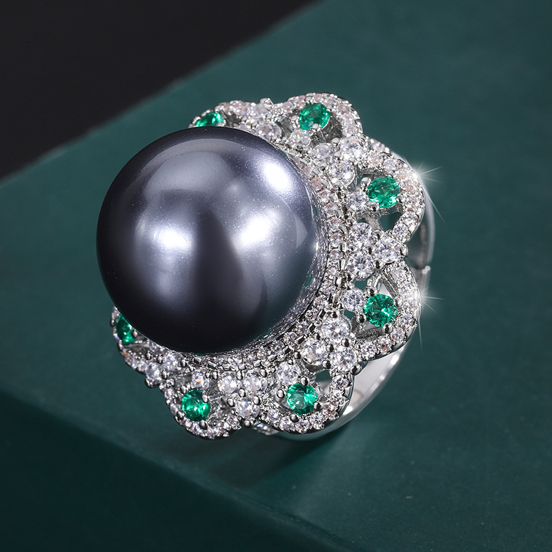 Anillo de platino con cuentas grises de tamaño abierto