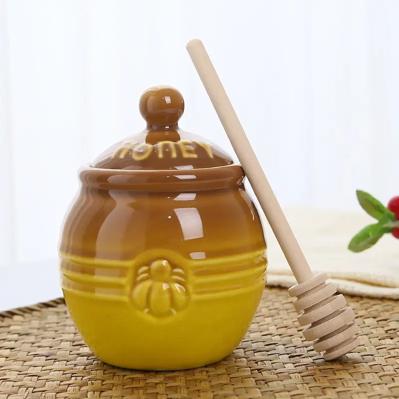 Tarro de miel rústico de cerámica de abeja en relieve esmaltado reactivo azul amarillo personalizado con tapa de cucharón caja de regalo con logotipo personalizado