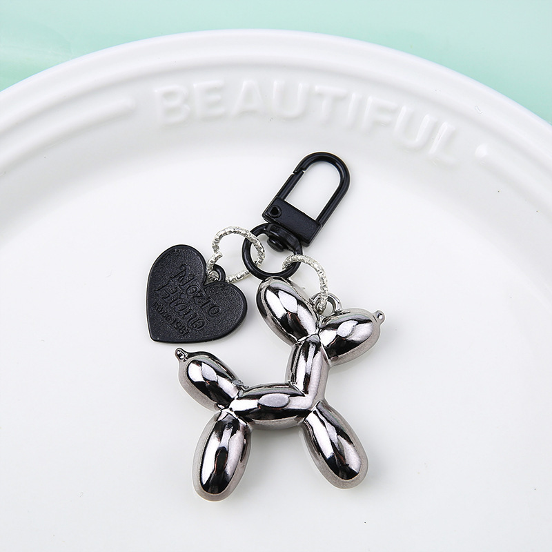 Chiot noir pistolet + boucle coeur/porte noire - sans emballage