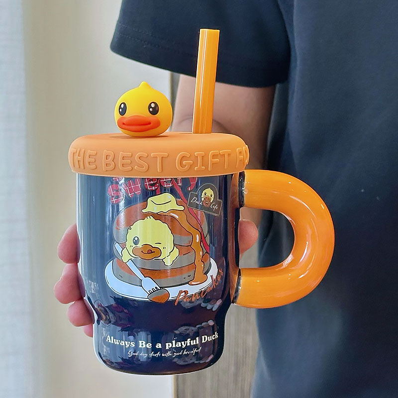 Tasse bleu foncé à capuchon orange