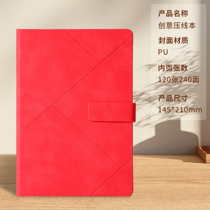 Libro con hebilla de presión roja.