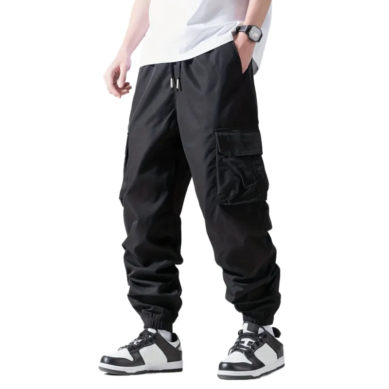 Calça cargo casual personalizada de alta qualidade com cordão para homens, jogging casual solta com vários bolsos para primavera ao ar livre