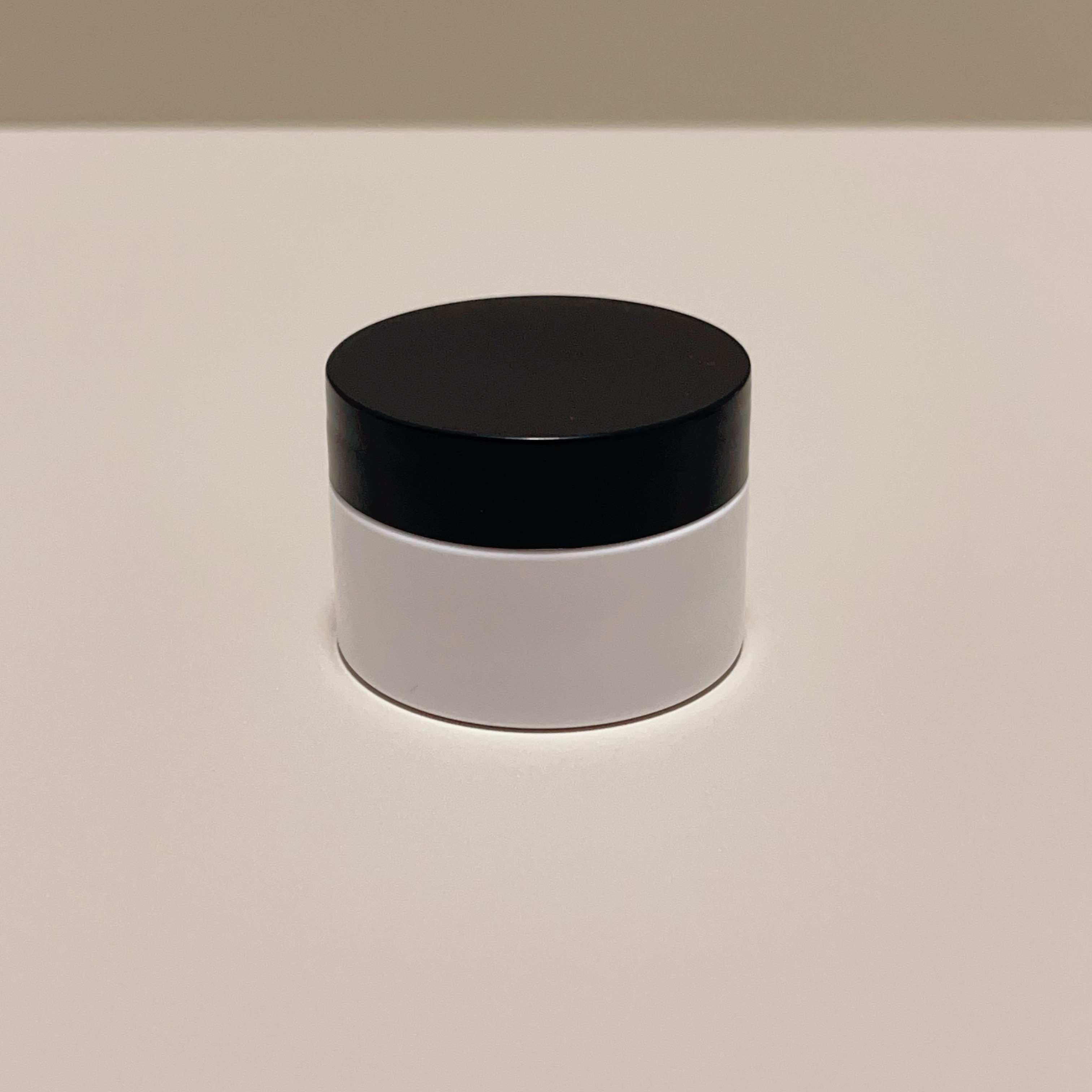 White Jar with Black Lid