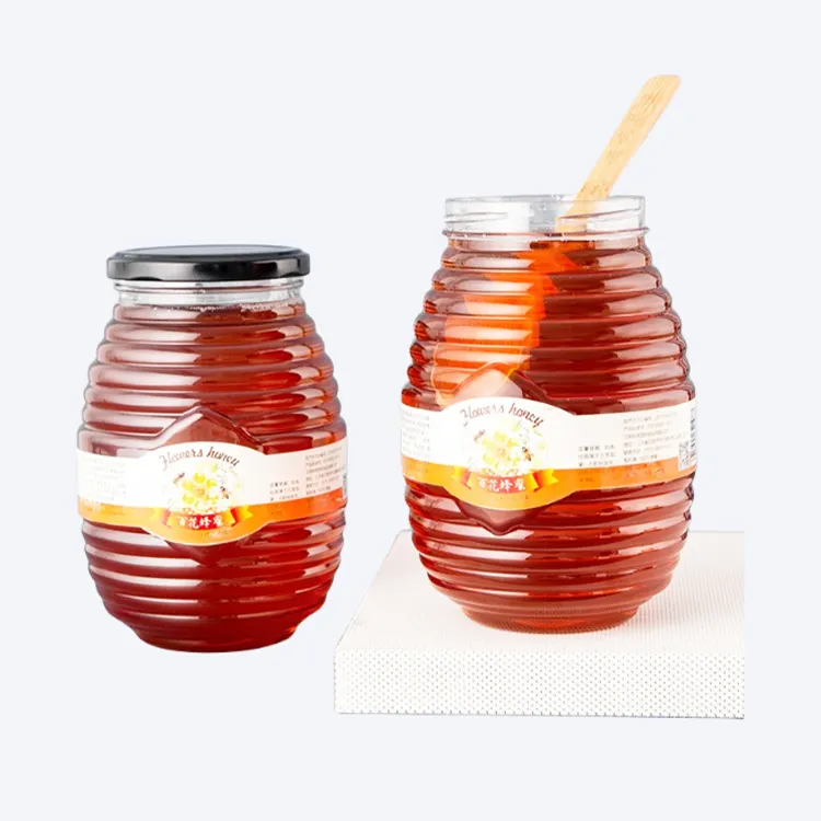 Fabricante al por mayor botella de miel redonda roscada botella de plástico de tornillo transparente botella de tapa de hojalata de 1000g