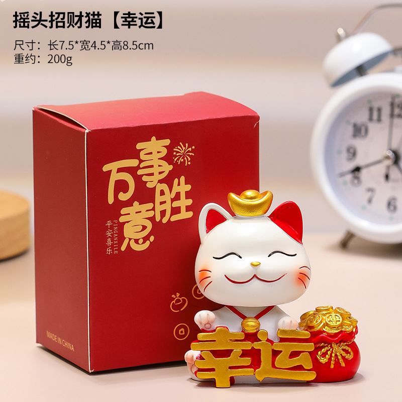 Bobbing lucky cat (symbolizing good fortune)