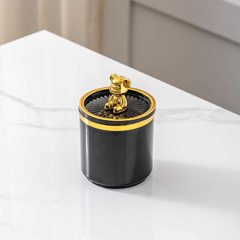Oso de peluche negro y dorado