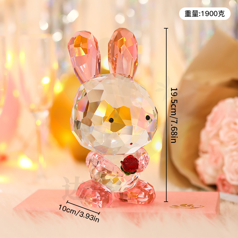 A pink rabbit holding red roses