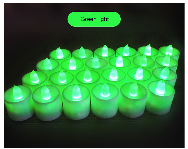 White candle with green light