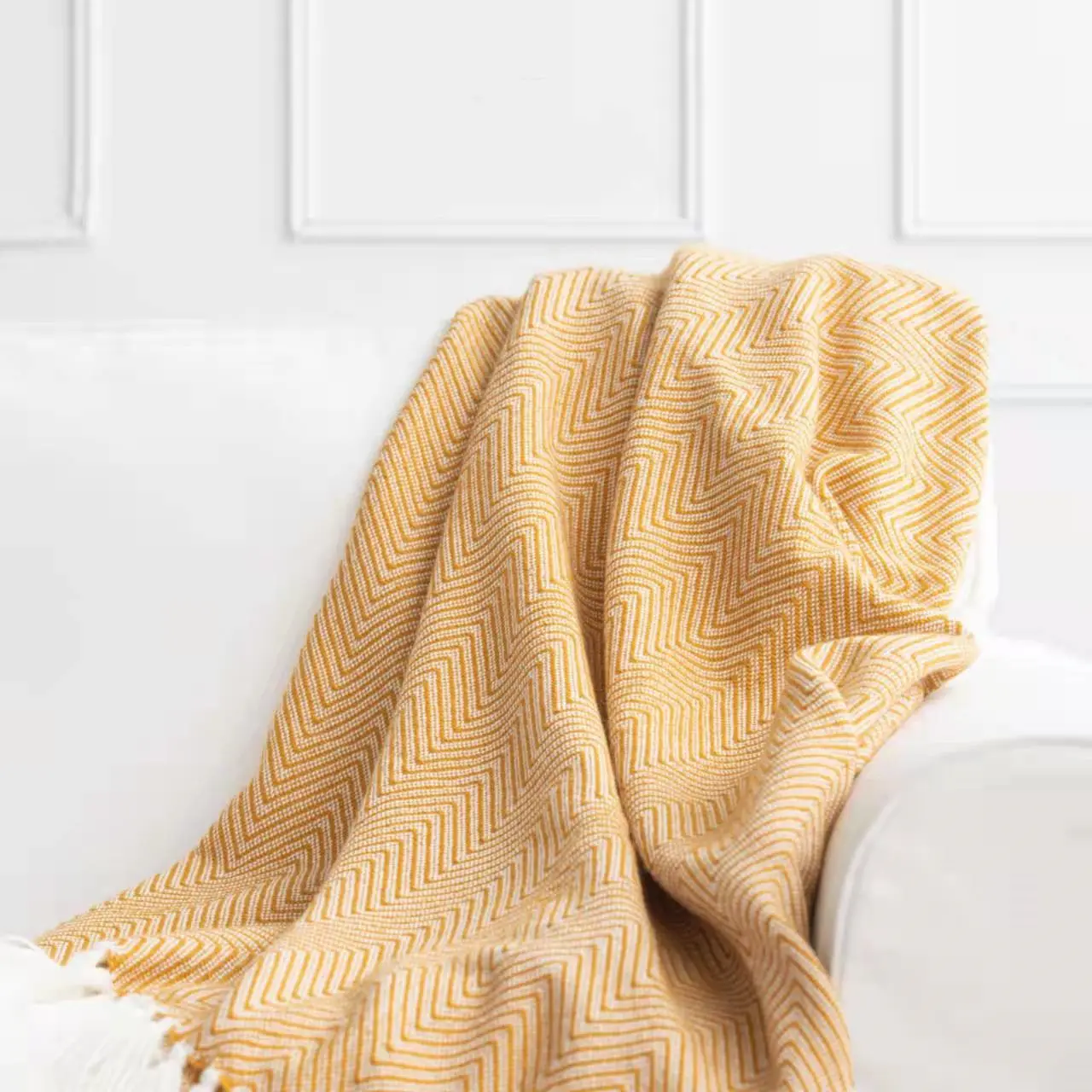 Coperta di lana lavorata a maglia coperta di lana a buon mercato all'ingrosso del pendente della nappa del modello della spina di pesce