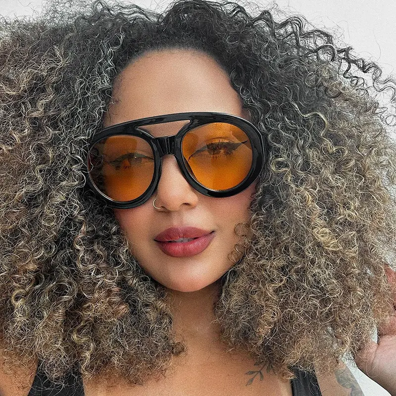 2024 gafas de sol personalizadas con montura grande fotos de calle de moda gafas de sol con forma cóncava para mujeres 9188