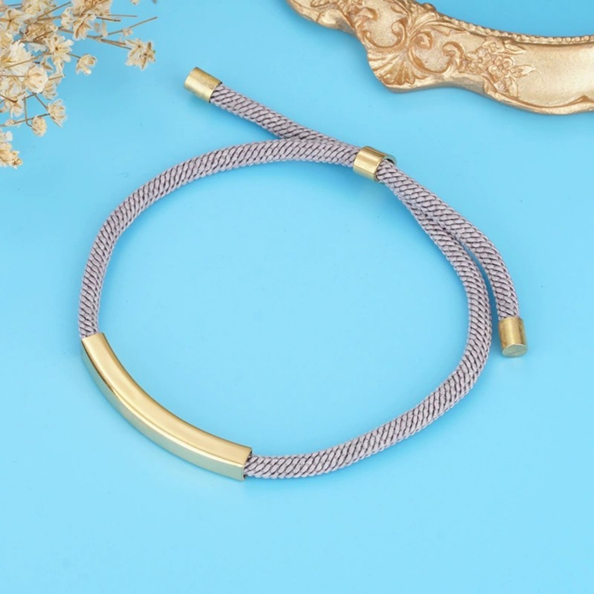 Ciondolo in oro + cordoncino grigio