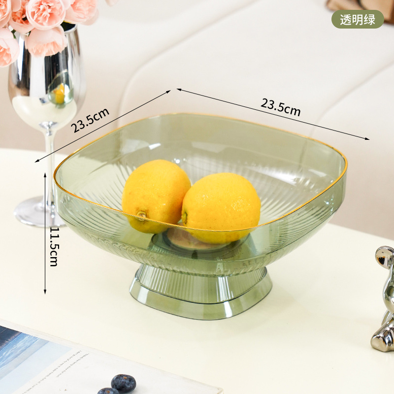 Tall, elegant fruit platter in transparent green.