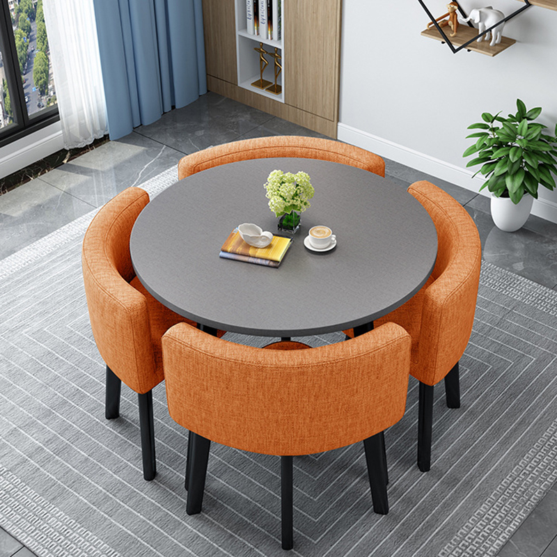 Gray round table + orange fabric chairs