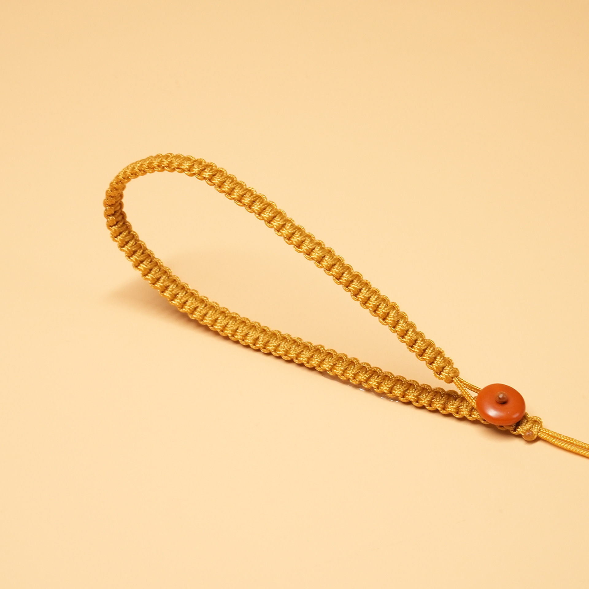 Bouton en forme d'olive jaune terreux