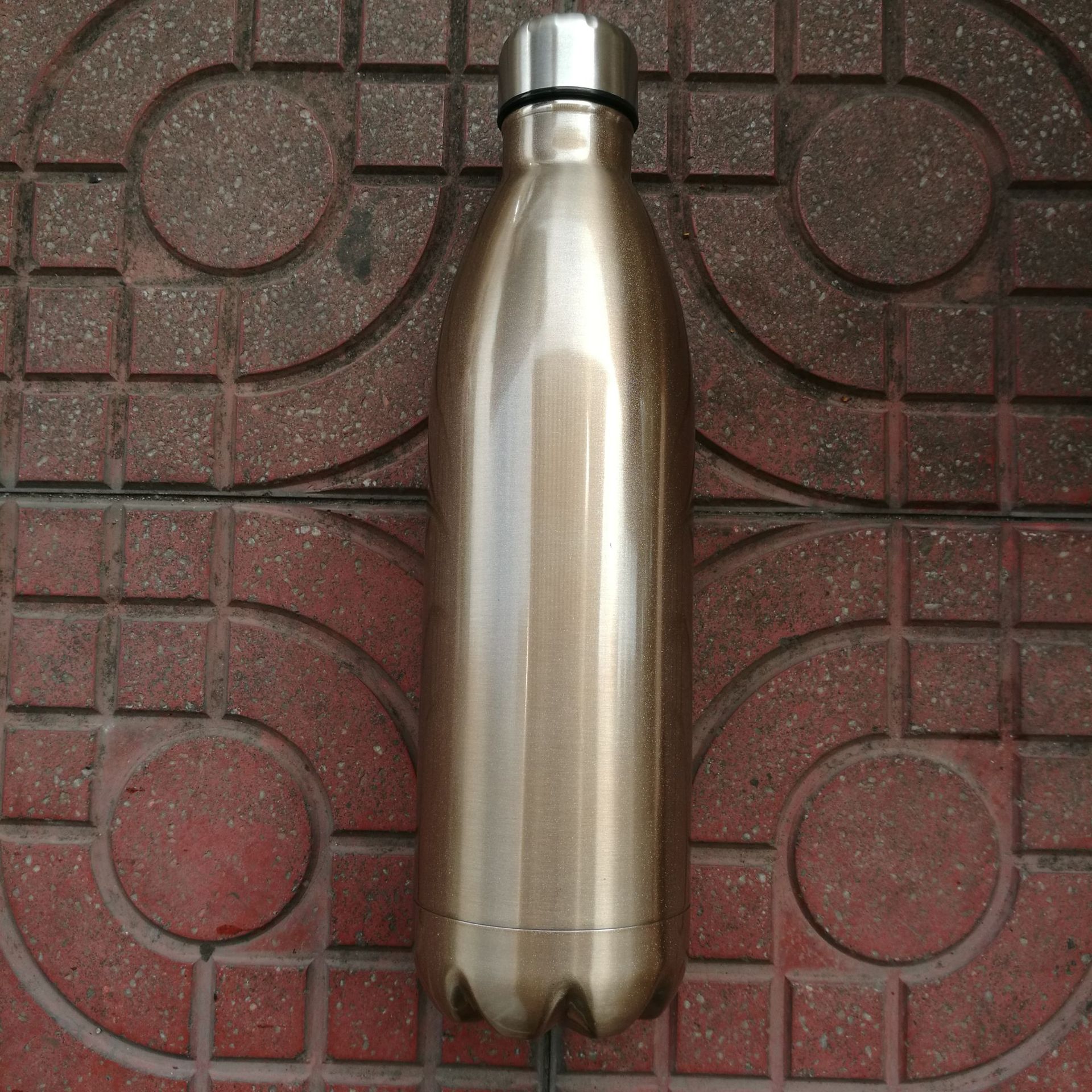 Coke bottle, bright gold 750ML.