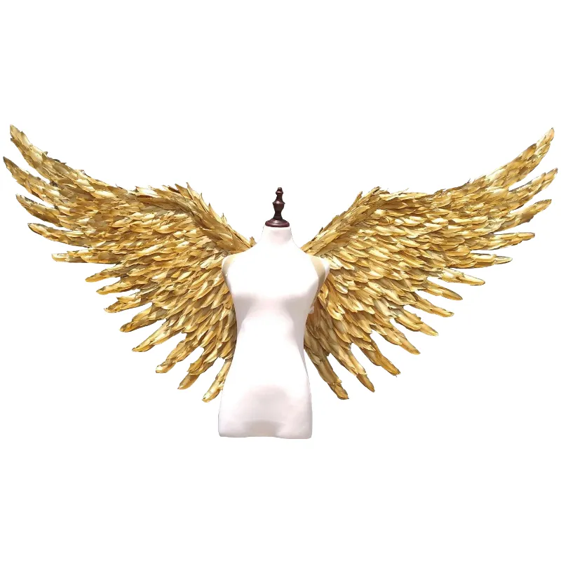 Large performance props show golden feather angel wings