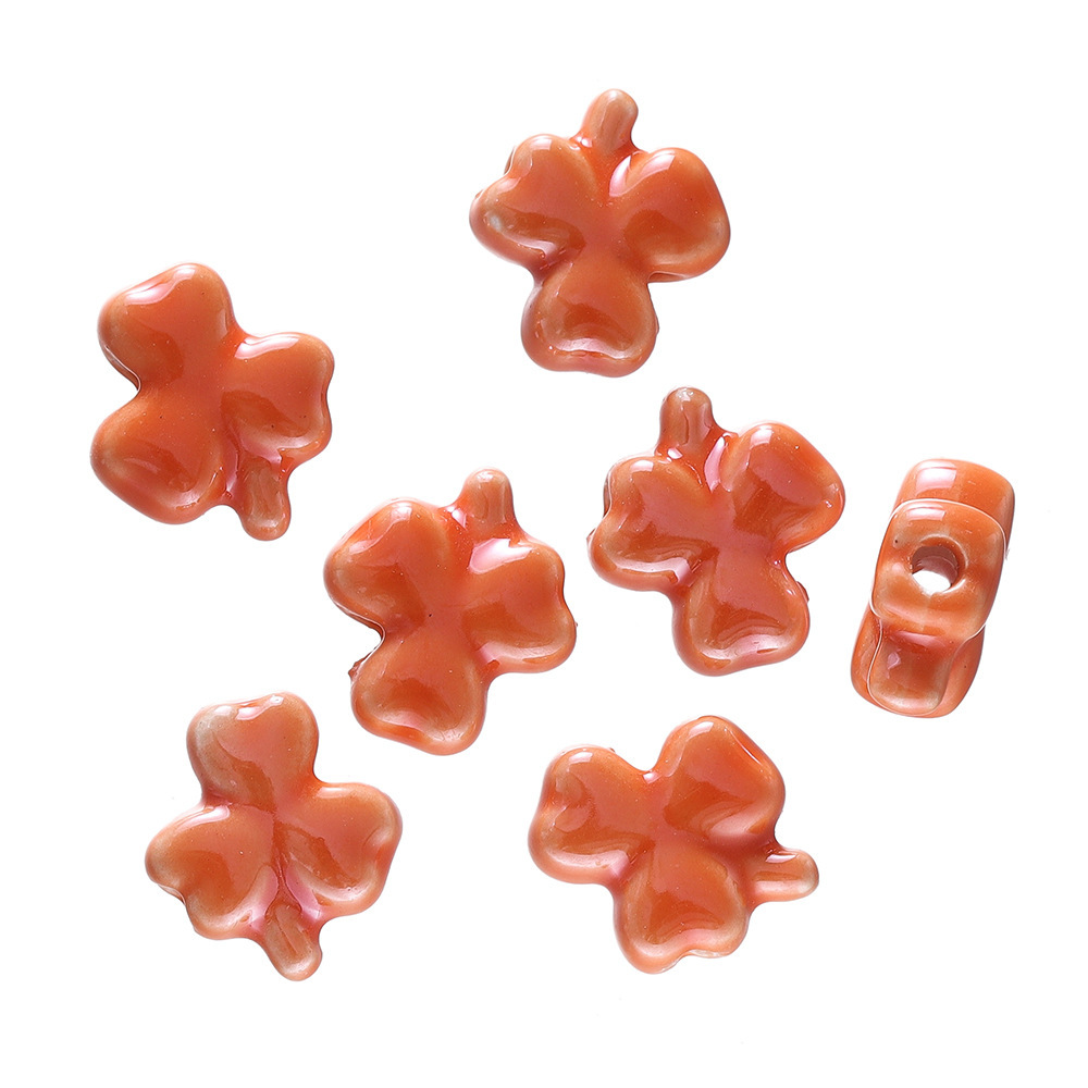 Perles trèfle en céramique - orange