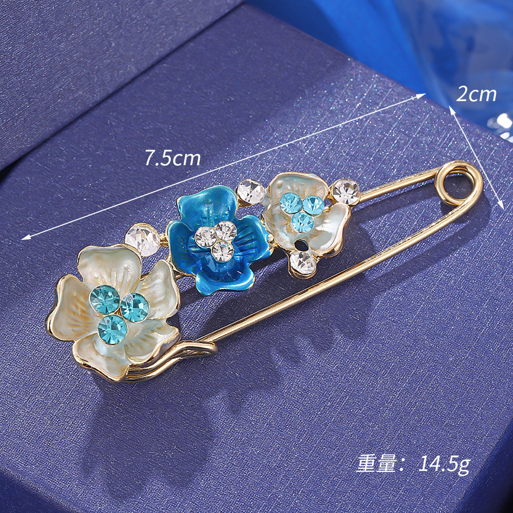 Broche de flor azul