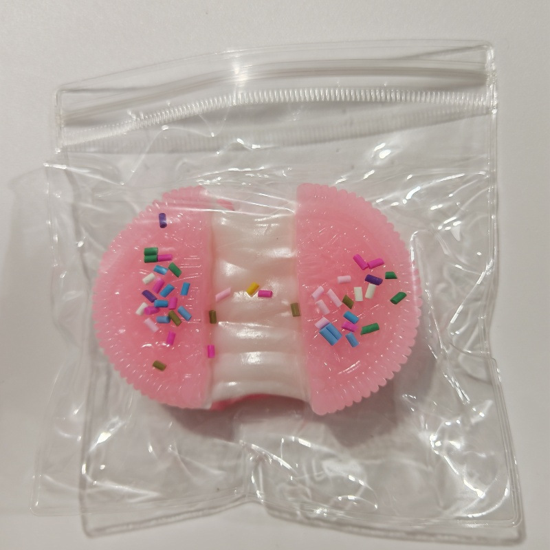 Enrobage de bonbons rose oreo brossé