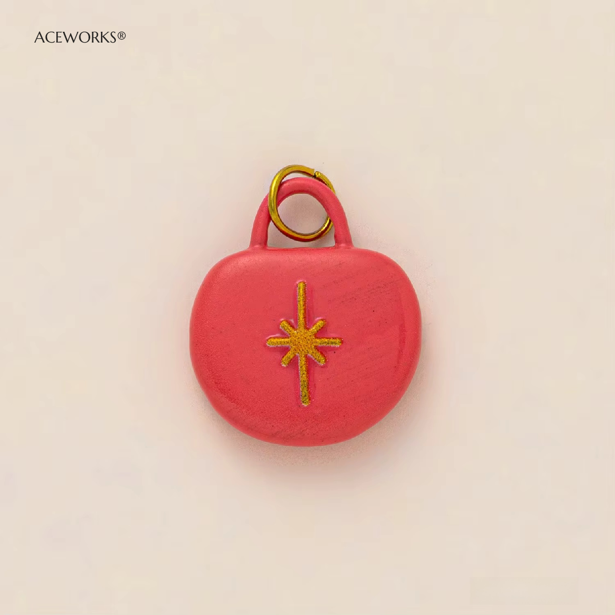 Amuleto de bolso estrella rosa