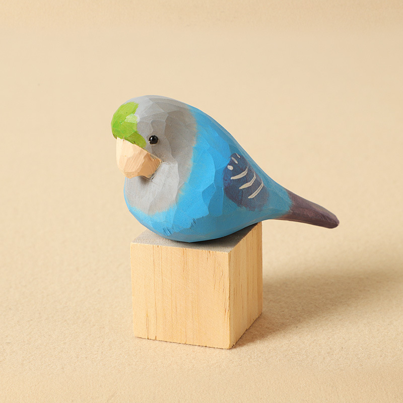Bloc de bois perroquet bleu sculpté