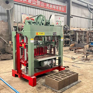 QT4-40マニュアル中空インターロッキングブロックレンガ製造機220Vセメントブロック製造用