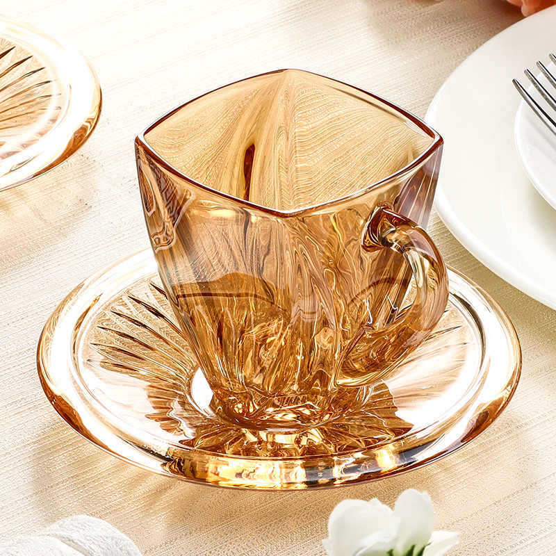 A pair of amber coffee cups