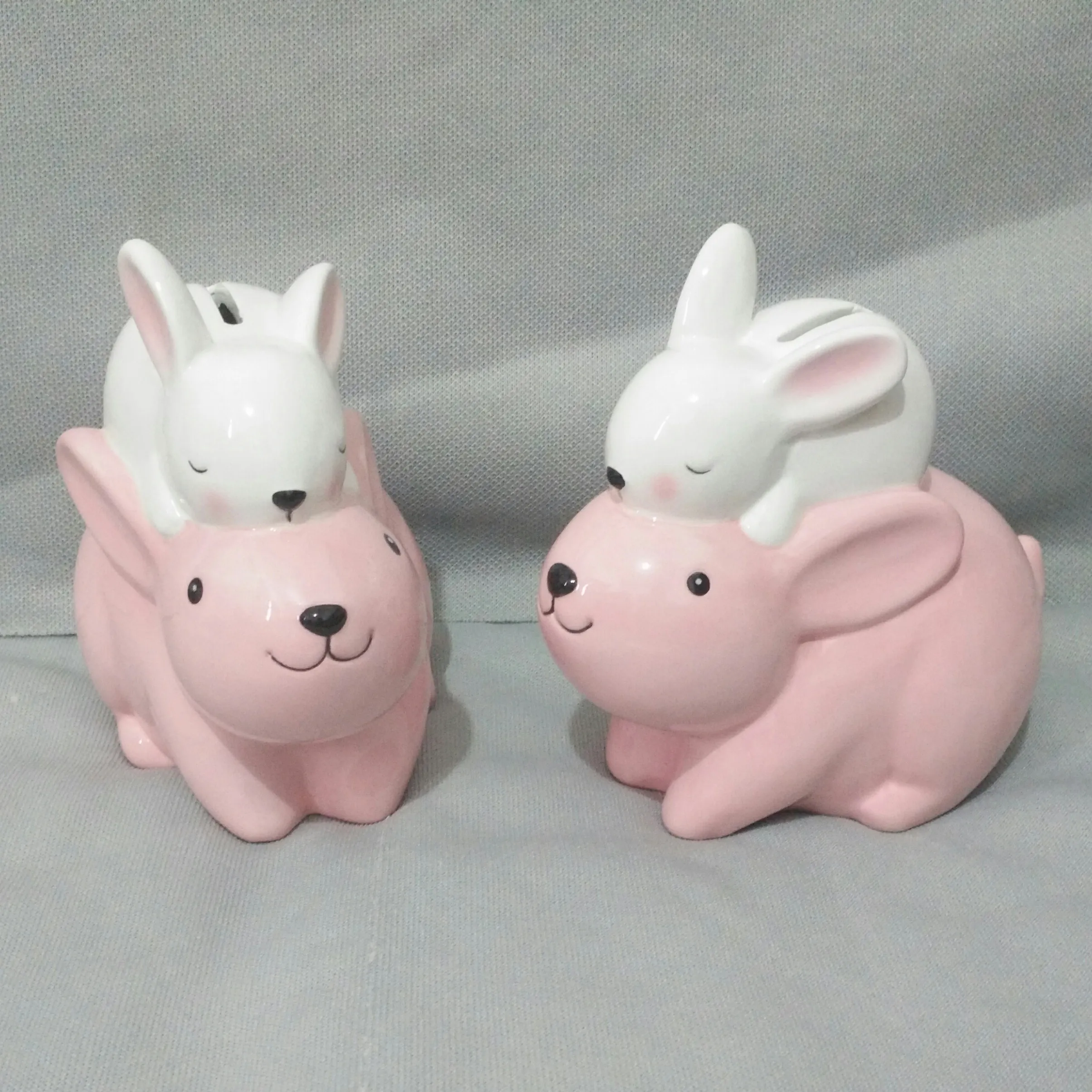 Hot selling lovely ceramic pink white rabbit money box piggy bank house