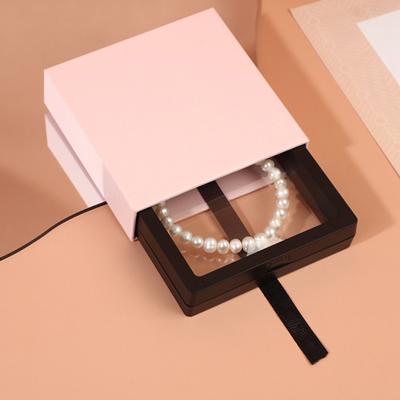 Caja de cartón duro y grueso rosa + caja de suspensión de PE negra