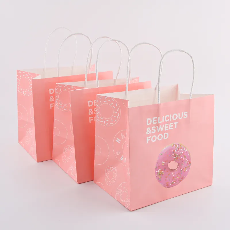Livraison perforée avec poignées papier alimentaire Kraft bonbons rose sac cadeau bon marché pour vêtements emballage de bijoux