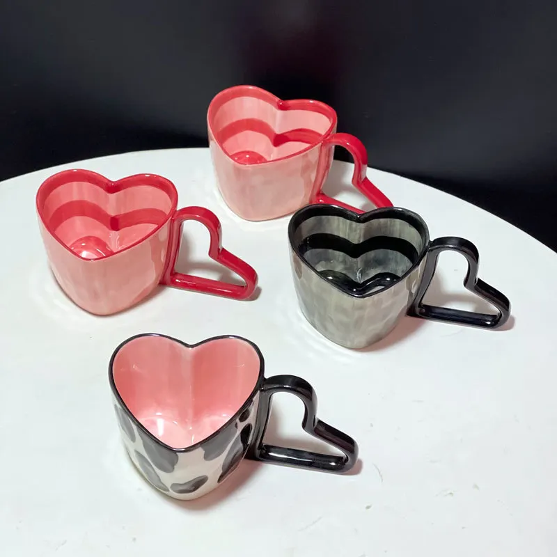 Venta al por mayor de tazas de café de cerámica con forma de corazón creativas Irregular Taza de cerámica con asa
