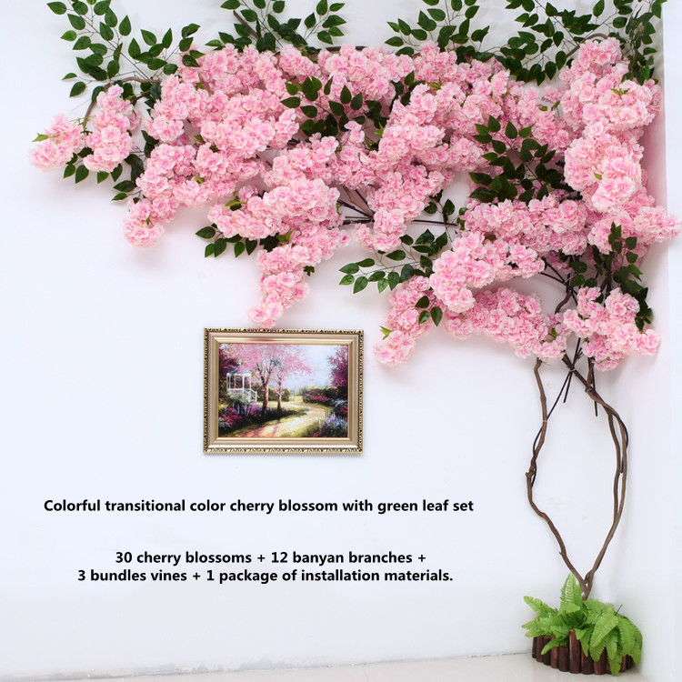 Arbre à fleurs de cerisier coloré avec feuilles vertes