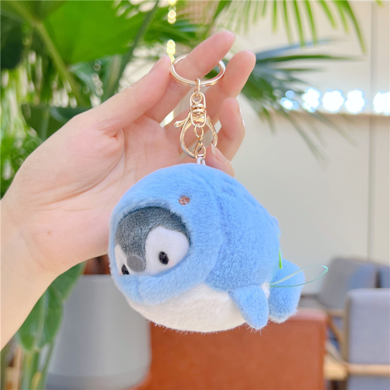 Hebilla dorada de pingüino delfín azul profundo