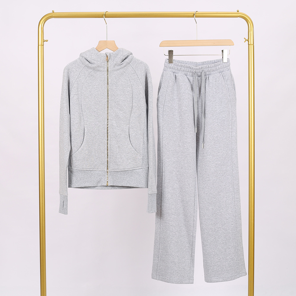 Conjunto ajustado con cremallera en gris jaspeado y dorado